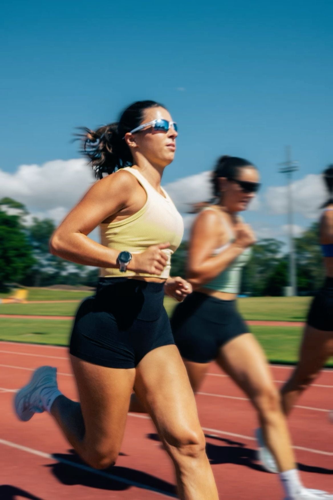 Athlete in motion wearing sports sunglasses